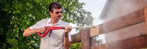 Cleaning Moss of a Wooden Fence